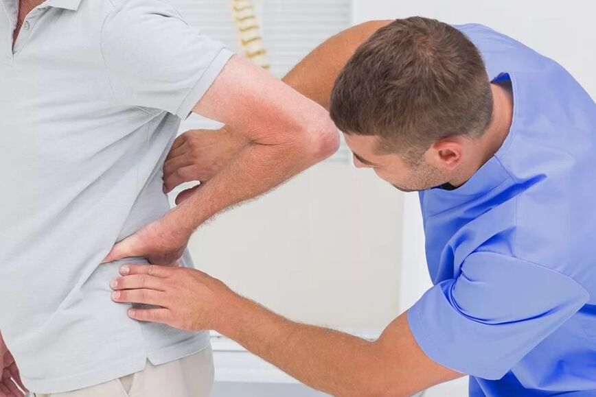 A patient with a lower back pain in a diagnostic examination of a doctor